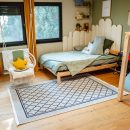 Teppich Bern im gemütlich eingerichteten Kinderzimmer mit Holzboden